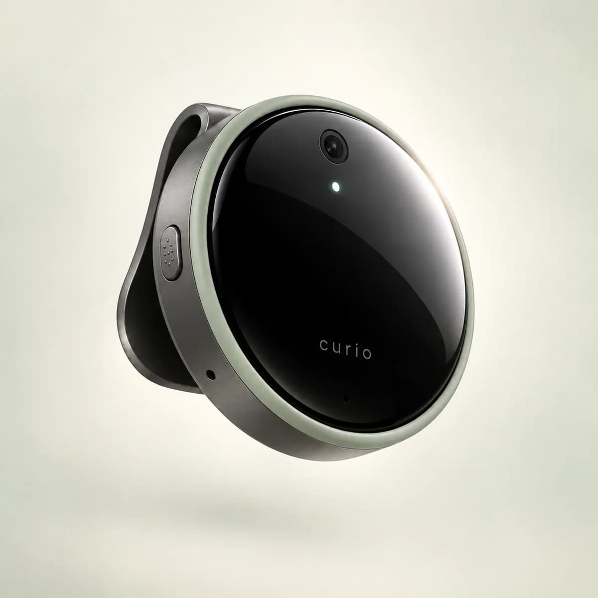 Curio design concept: a circular dark glass wearable with a sage protective rim, a side talk button, and a camera
